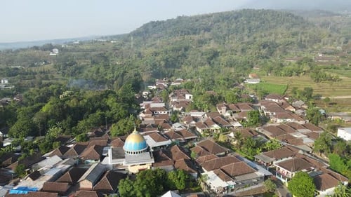 Aerial Drone View of Farmland and Central Mosque in Village
