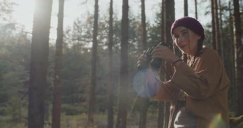 Woman Searching Through Binoculars on Sunny Day