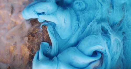 Blue and Brown Paint Swirling Together