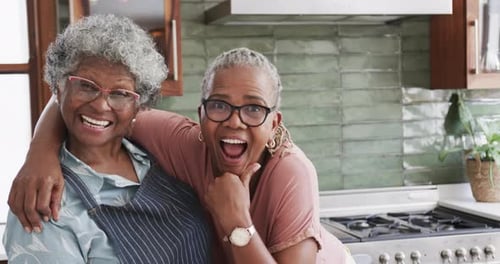 Two Senior Women Smiling in the Kitchen