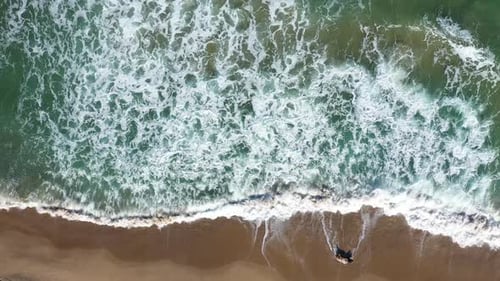 Flying Over a Tropical Paradise With Sea Waves Washing Sandy Beach. Aerial Drone View