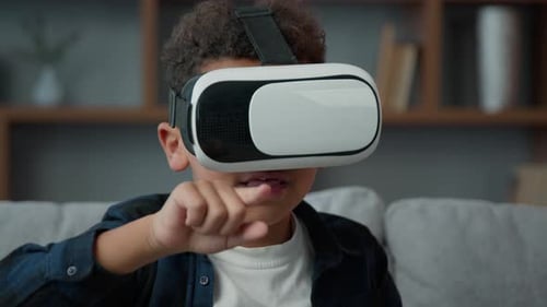 Child Plays with Virtual Reality Goggles in Home