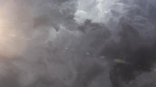 Abstract Background with Swirling Dark Clouds and Light