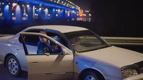 Urban Driver Portrait Confident Driver Leaning From Vehicle Under Bridge Man Sitting Relaxed in Open