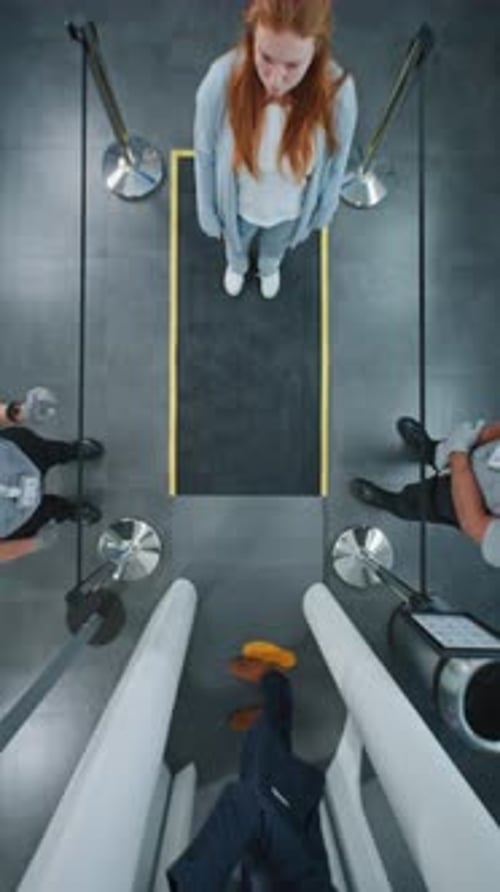 Airport Terminal Queue of Diverse People Travelers Walking Through Xray Scanning Metal Detector