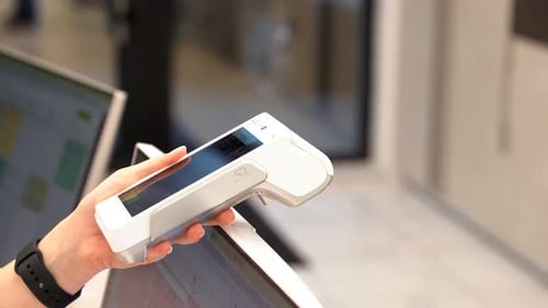Woman Makes Contactless Payment Over Credit Card Reader