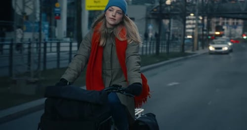 Woman in Early Winter Dawn Morning Cycle to Work