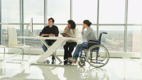 Teamwork Brainstorm Diverse Multiracial Colleagues Woman in Chair for People with Disability Working
