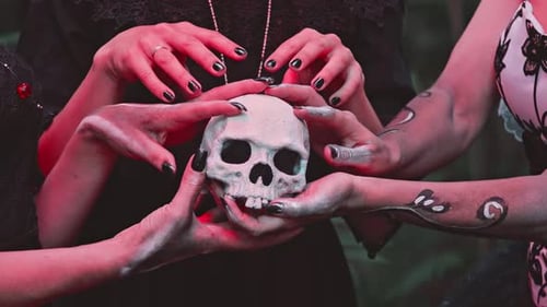 Three Young Women with a Design on the Face and Neck in the Style of the Goddess of Death or