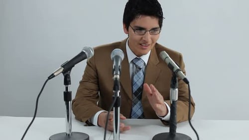 Young man giving speech at a press conference