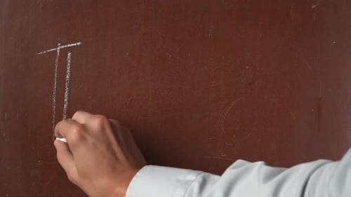 Hand Writes Thanks on Brown Surface with Chalk