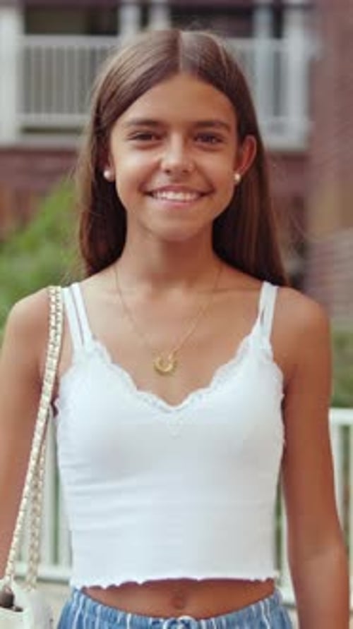 Smiling Teen Girl Poses Outdoors in Summer