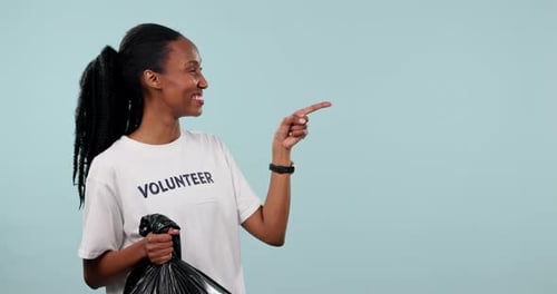 Cleaning trash bag, volunteer and black woman point at garbage pollution news