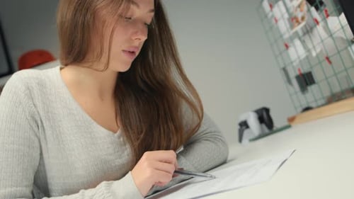 Close-up: woman lawyer office worker proofreading a contract before signing