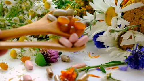 Pills and Capsules with Daisies and Wildflowers