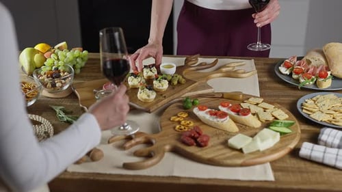 Adults Enjoying Charcuterie and Wine at Home