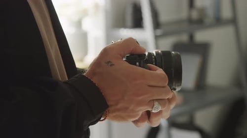 Unrecognizable Male Photographer Shooting on Dslr Camera in Studio