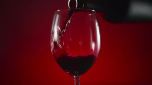 Pouring Red Wine into Glass Close Up