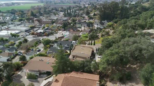 Drone Wide Shot of Suburban Residential Subdivision House in Neighborhood Street and Hill California