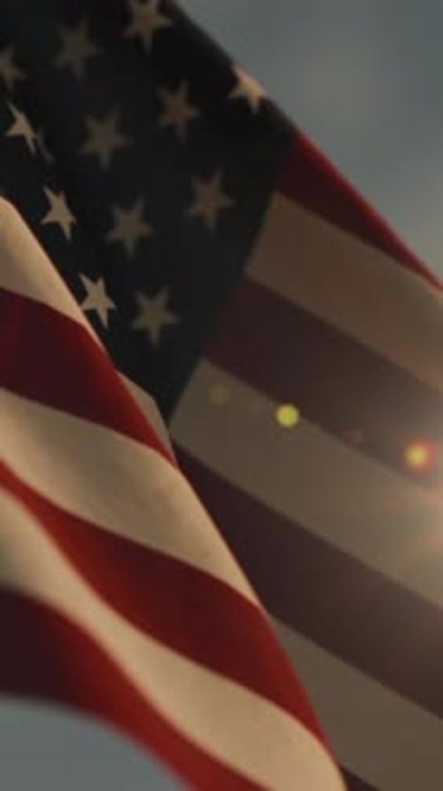 American Flag Waving with Sun Flare Vertical Video