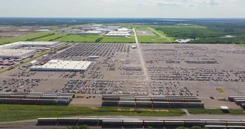 New Cars Parked for Sale on Automotive Factory Parking Lot Dealer Vehicle Inventory for Import and