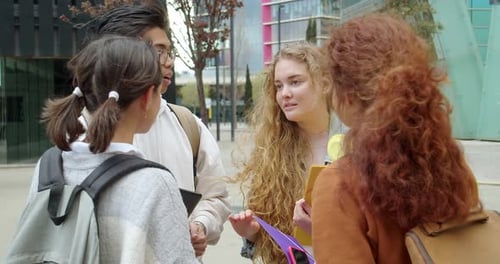Group of Millennial Teenage Student Friends Talking to Each Other on a Campus