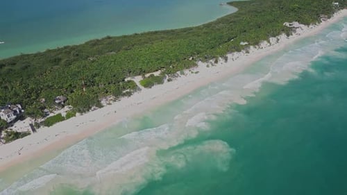 Gentle Tides Glide Wide as Waves Collide Along the Tropical Shoreline