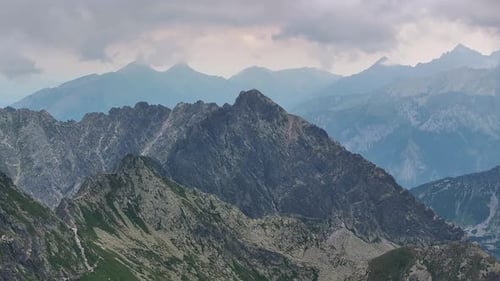 Majestic mountain range overcast skies reveal natures serenity and beauty