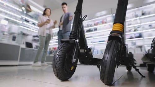 A Man and a Woman in a Shopping Mall in an Electronic Goods Store