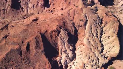 Aerial top view drone flying over scenic red rocky mountains