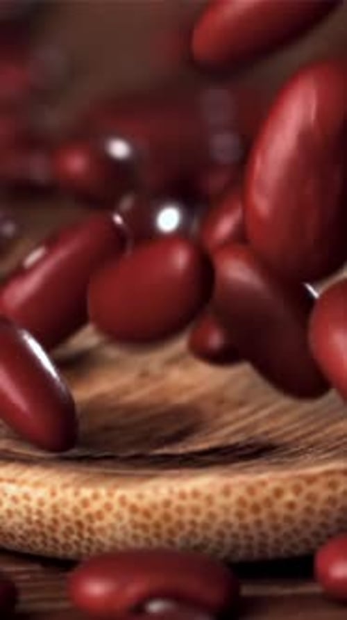 Red Beans Falling on a Wooden Table Filmed on a Highspeed Camera at 1000 Fps