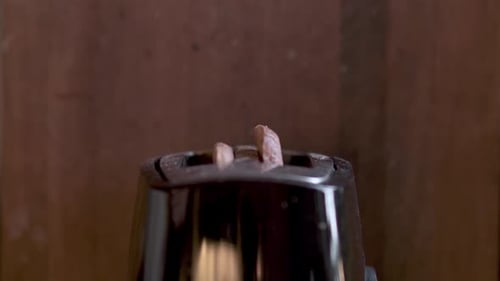 Toast Popping Up in a Toaster