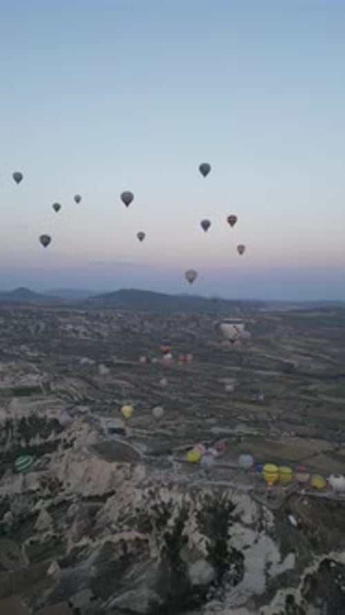 Aerial video over monoliths in Cappadocia, on hot air balloons, Turkey