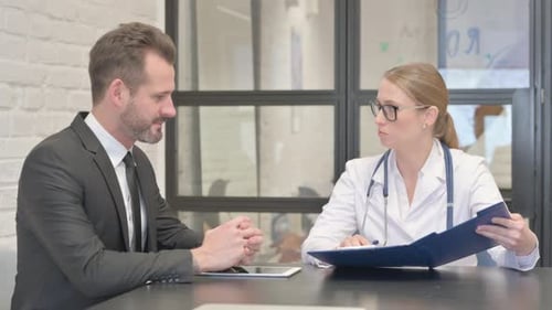 Female Doctor Talking with Young Man