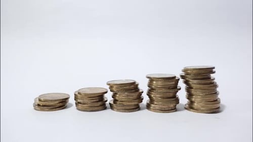 Rising Stacks of Coins on a White Background