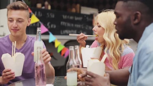 Friends Enjoying Take-Out at a Food Truck