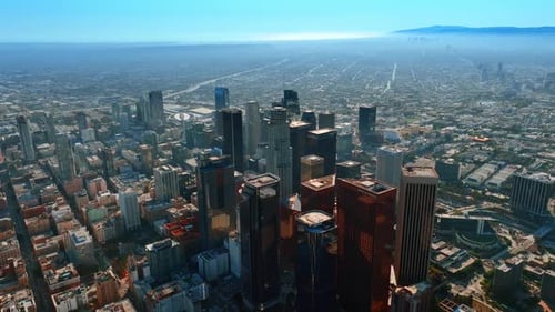 Footage high above the downtown high-rise architecture. Sunny view of Los Angeles, California, USA