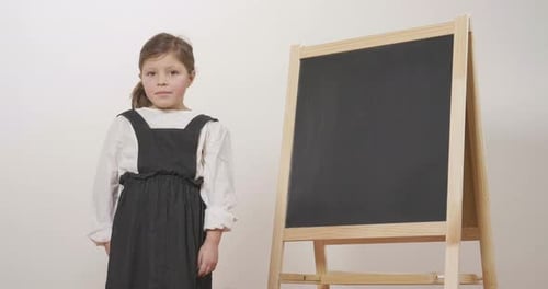 Young Girl Portrait with Chalkboard
