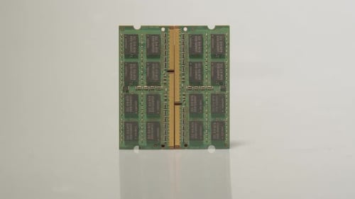 RAM module sticks slowly being being covered in darkness by moving top light