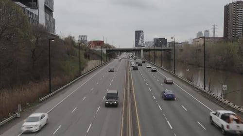 Traffic trailing off into the distance on an overcast day.