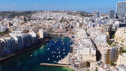 Aerial View of Sliema Harbour in Malta with Boats and Towers