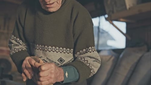 Old Carpenter Grandfather with Old Hands in the Studio Working on Wood