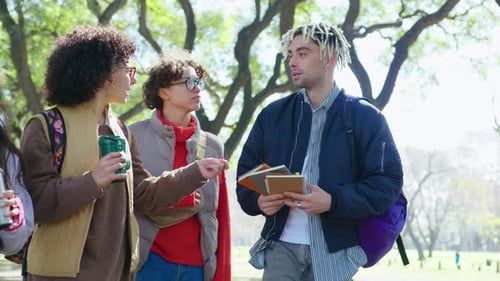 Friends Walking in Park after Studying in College