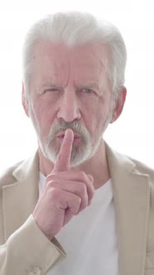 Old Man Showing Quiet Sign by Finger on Lips, Vertical Video