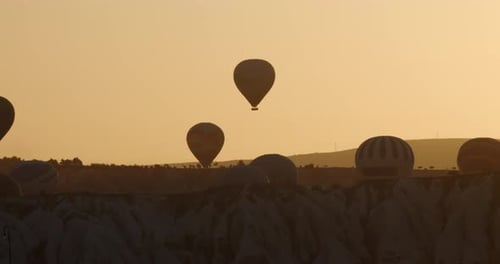 Stunning Aerial Views of Hot Air Balloons at Sunrise in Cappadocia, Turkey
