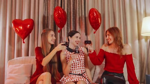 Three Women Celebrate and Toast with Wine