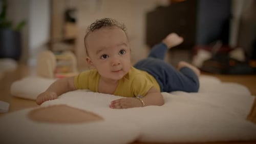 Cute Baby Lying on Stomach Indoors