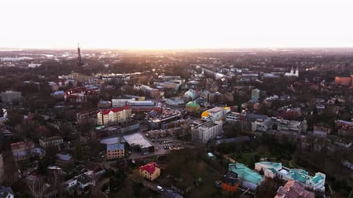 Golden Hour Aerial View of Āgenskalns Riga – Warm Sunset Over Urban District
