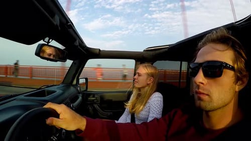 Big Sur, California / USA - July 17 2017: Couple Driving Jeep