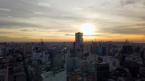 Time lapse of skyscrapers and buildings, in Buenos Aires city, at sunset, on a sunny evening, in Arg